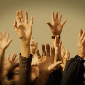 Higher Education: Students Raising Hands to Ask Questions
