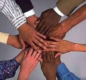 Corporate: Diverse Hands with Suit and Shirt Cuffs Joined Together as a Team