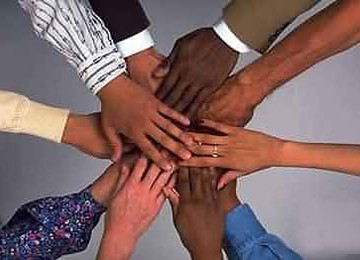 Corporate: Diverse Hands with Suit and Shirt Cuffs Joined Together as a Team